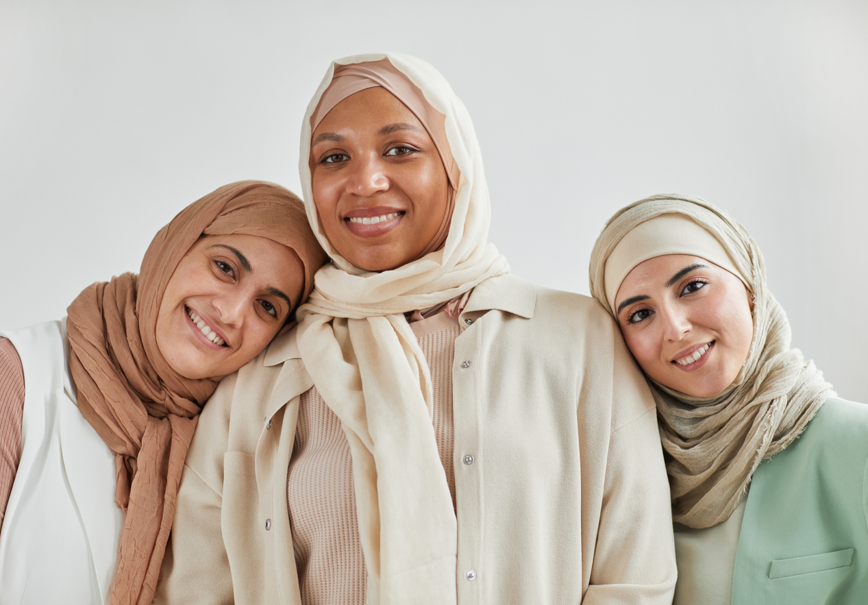 Happy Women in Business Attire and Hijabs
